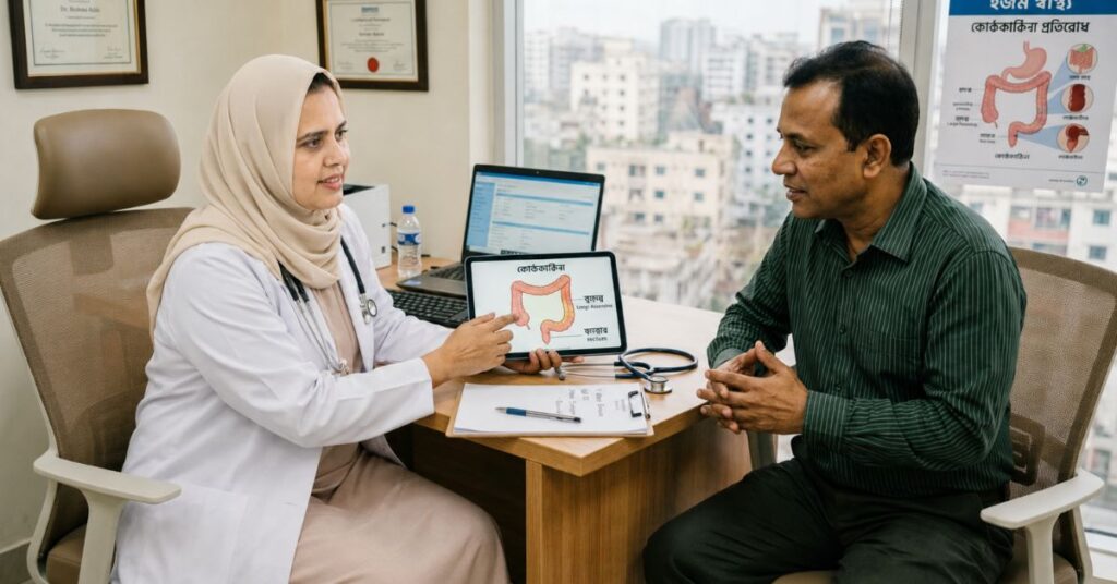 Female doctor explains chronic constipation treatment to a male patient using a colon diagram in a Dhaka clinic